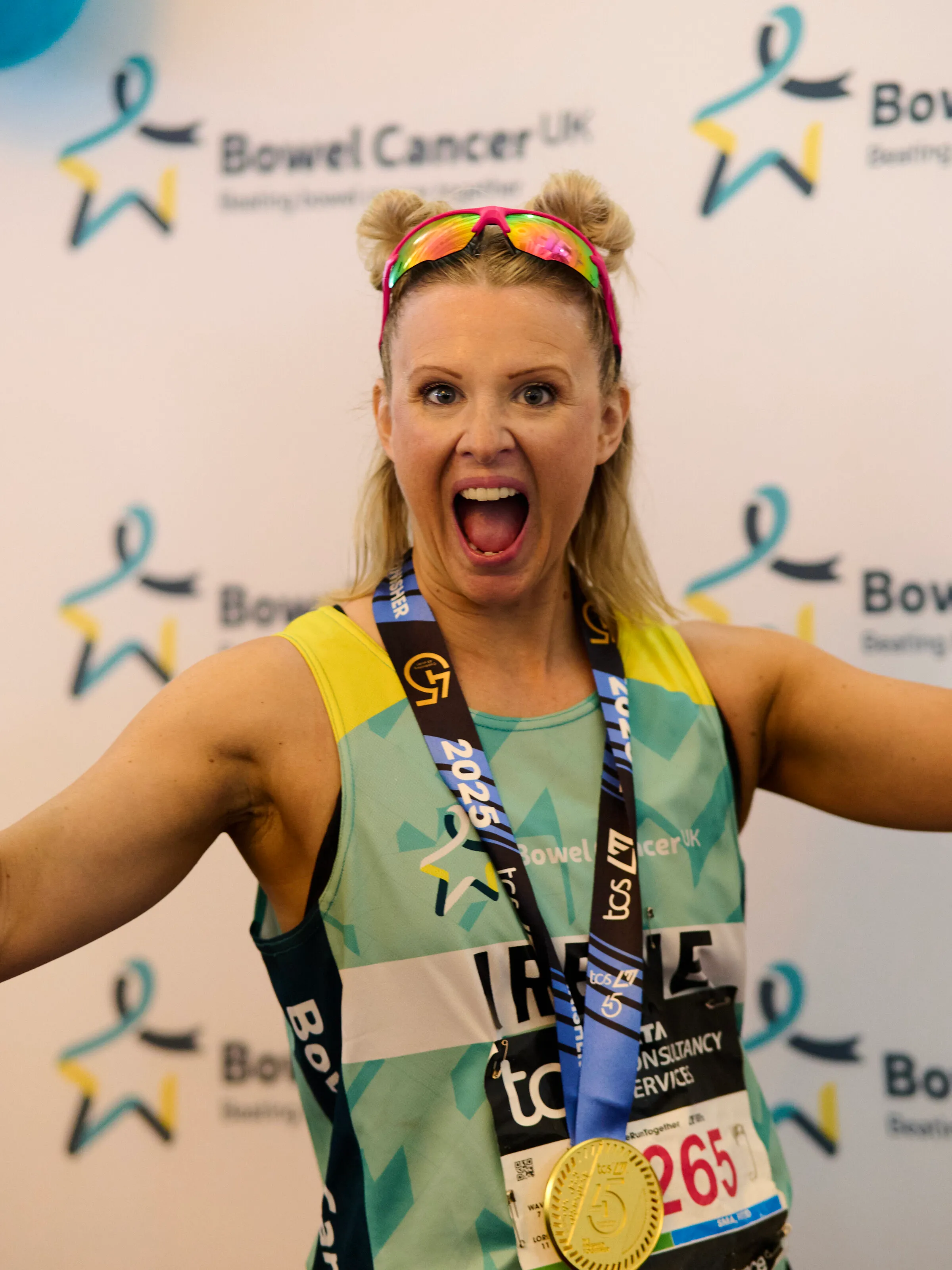 London Marathon — arms out, medal earned